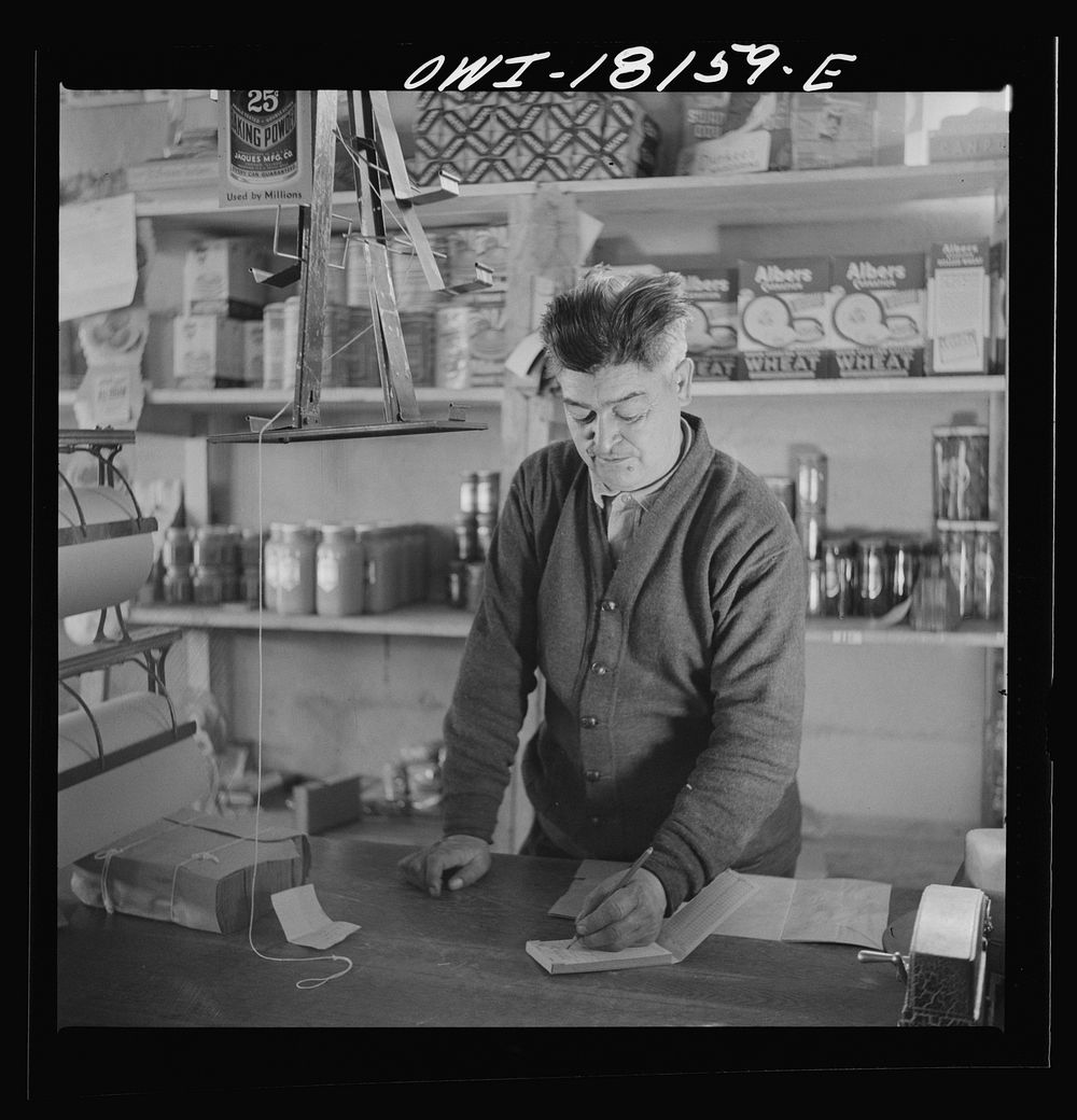 Questa, Taos County, New Mexico. The keeper of the general store. Sourced from the Library of Congress.