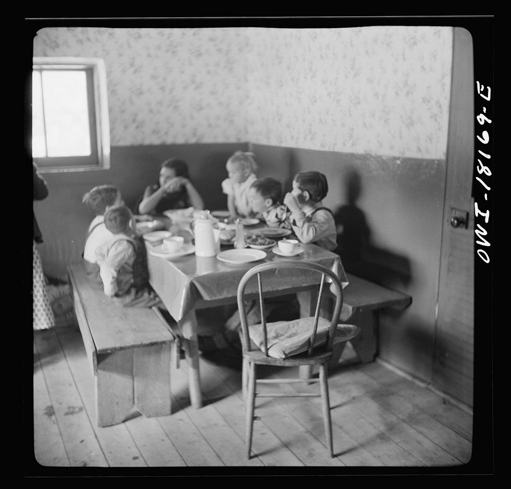 Trampas, New Mexico. The family of Juan Lopez at dinner. Sourced from the Library of Congress.