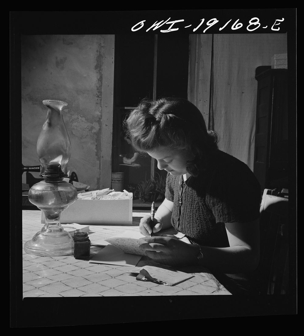 Moreno Valley, Colfax County, New Mexico. Mary Mutz on the ranch writing to a boyfriend in the United States Army. Sourced…