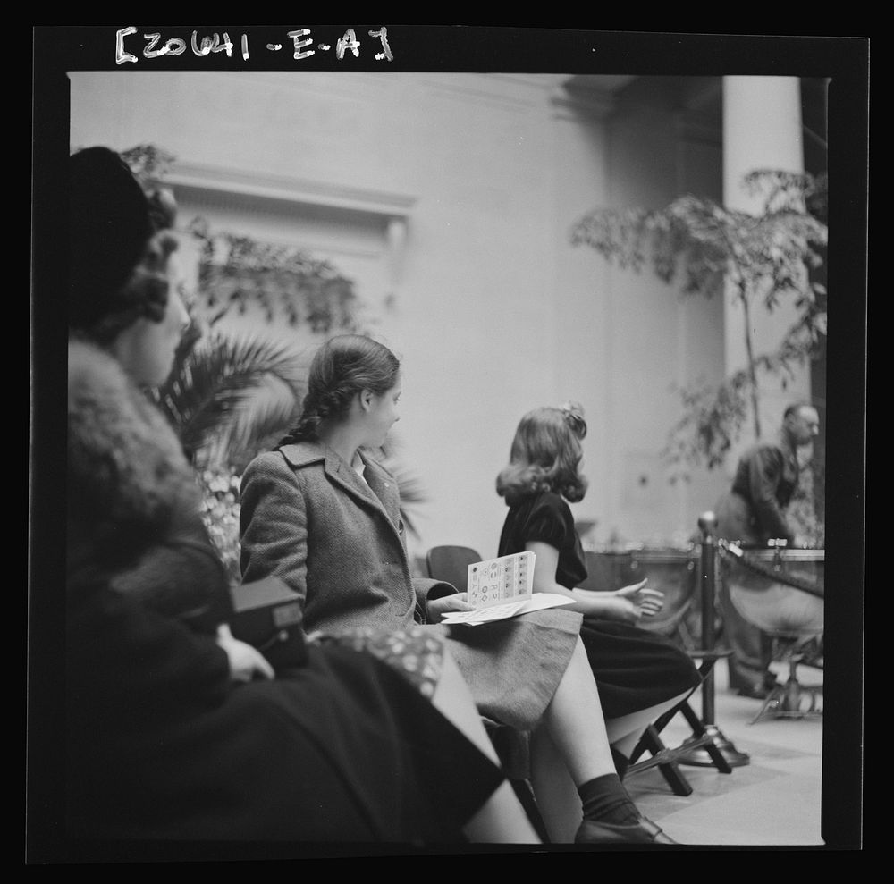 [Untitled photo, possibly related to: Washington, D.C. Listening to a concert at the National Gallery of Art]. Sourced from…