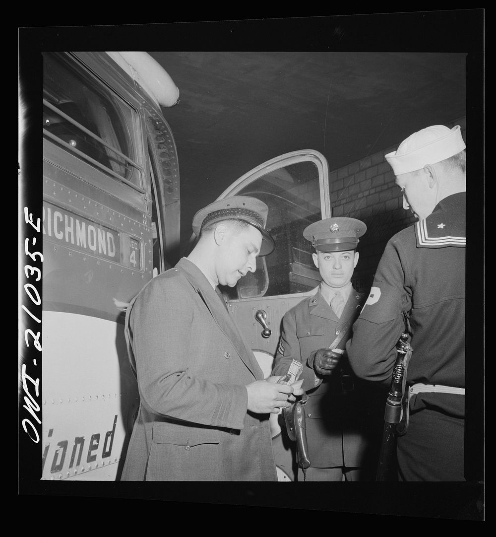 Washington, D.C. Driver checking ticket of a soldier who is entering the bus at the Greyhound terminal. Sourced from the…