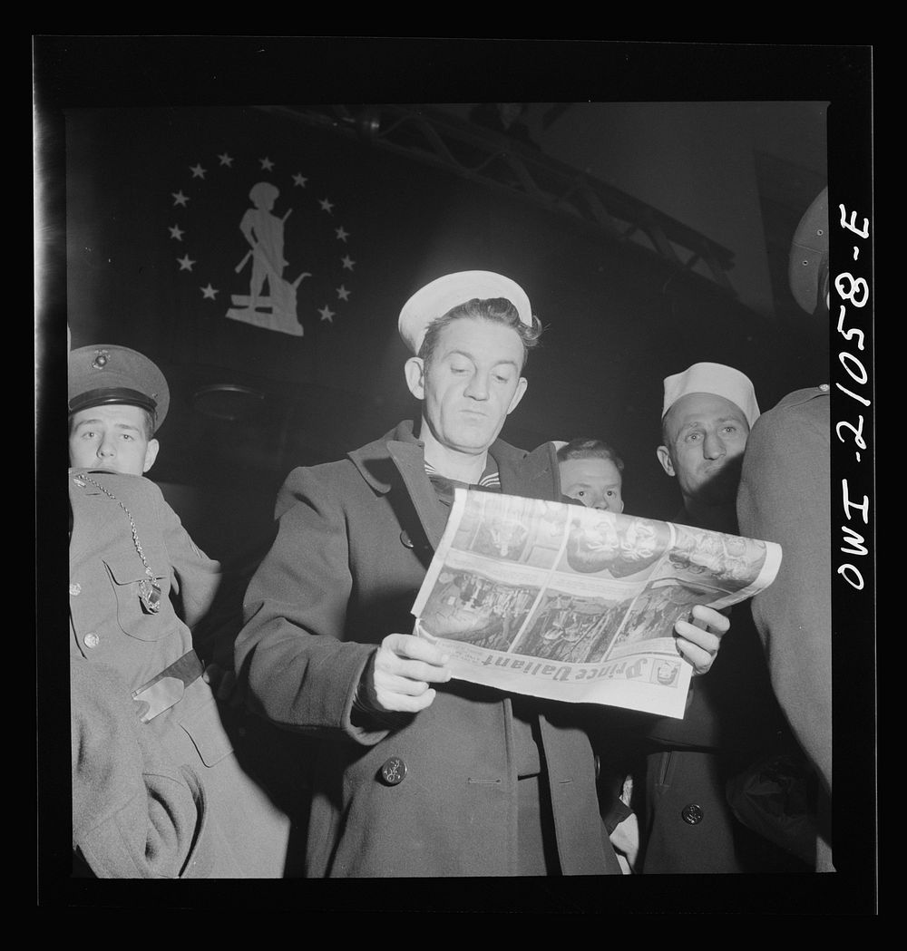 Washington, D.C. Sailor reading in line while waiting to board a bus at the Greyhound terminal. Sourced from the Library of…