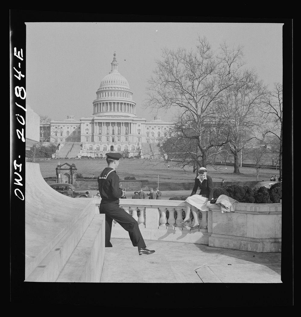 Washington, D.C. Sailor taking a picture of his girlfriend at a monument in front of the Capitol on a Sunday afternoon.…