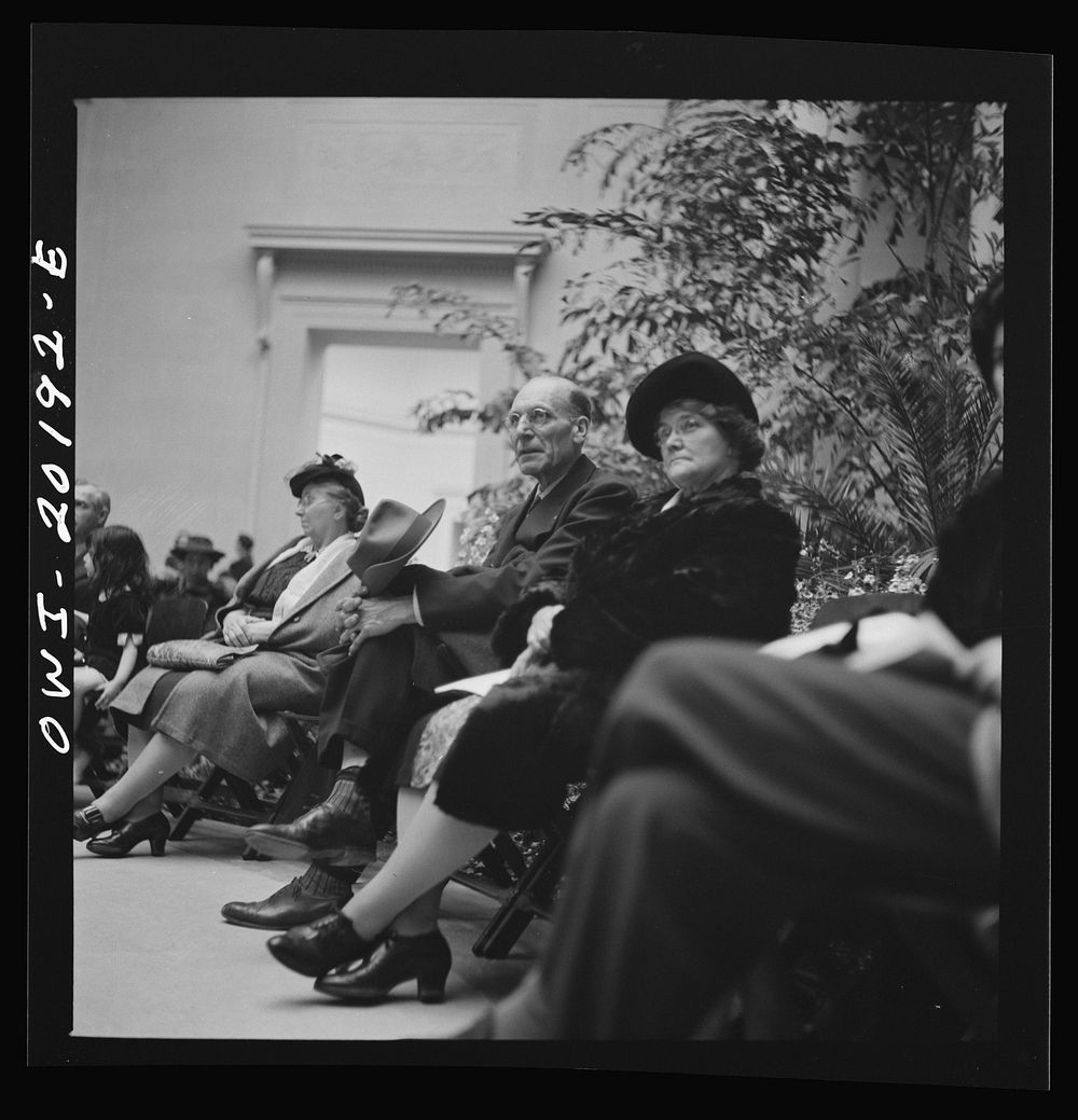 Washington, D.C. Listening to a concert at the National Gallery of Art. Sourced from the Library of Congress.
