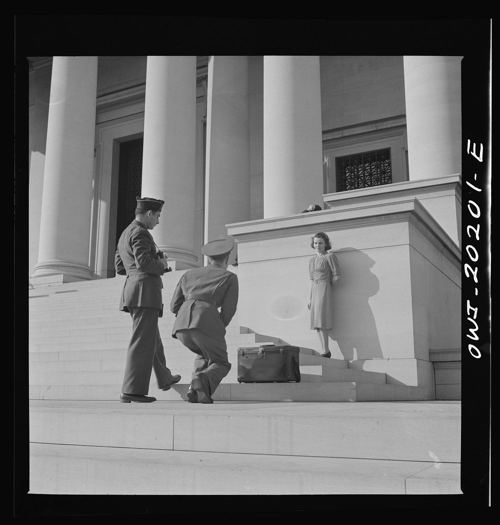 Washington, D.C. Soldiers taking pictures of a girl on the steps of the National Gallery of Art on a Sunday afternoon.…
