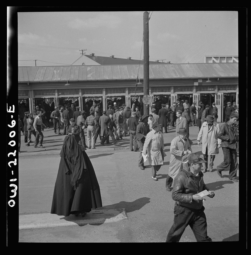 [Untitled photo, possibly related to: Baltimore, Maryland. Second shift workers leaving the Bethlehem Fairfield shipyard at…
