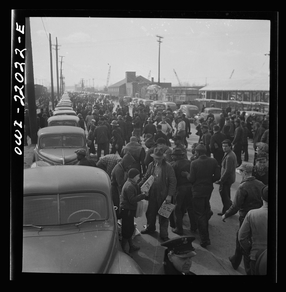 Baltimore, Maryland. Second shift workers leaving the Bethlehem Fairfield shipyard at three p.m. making a dash for cars…