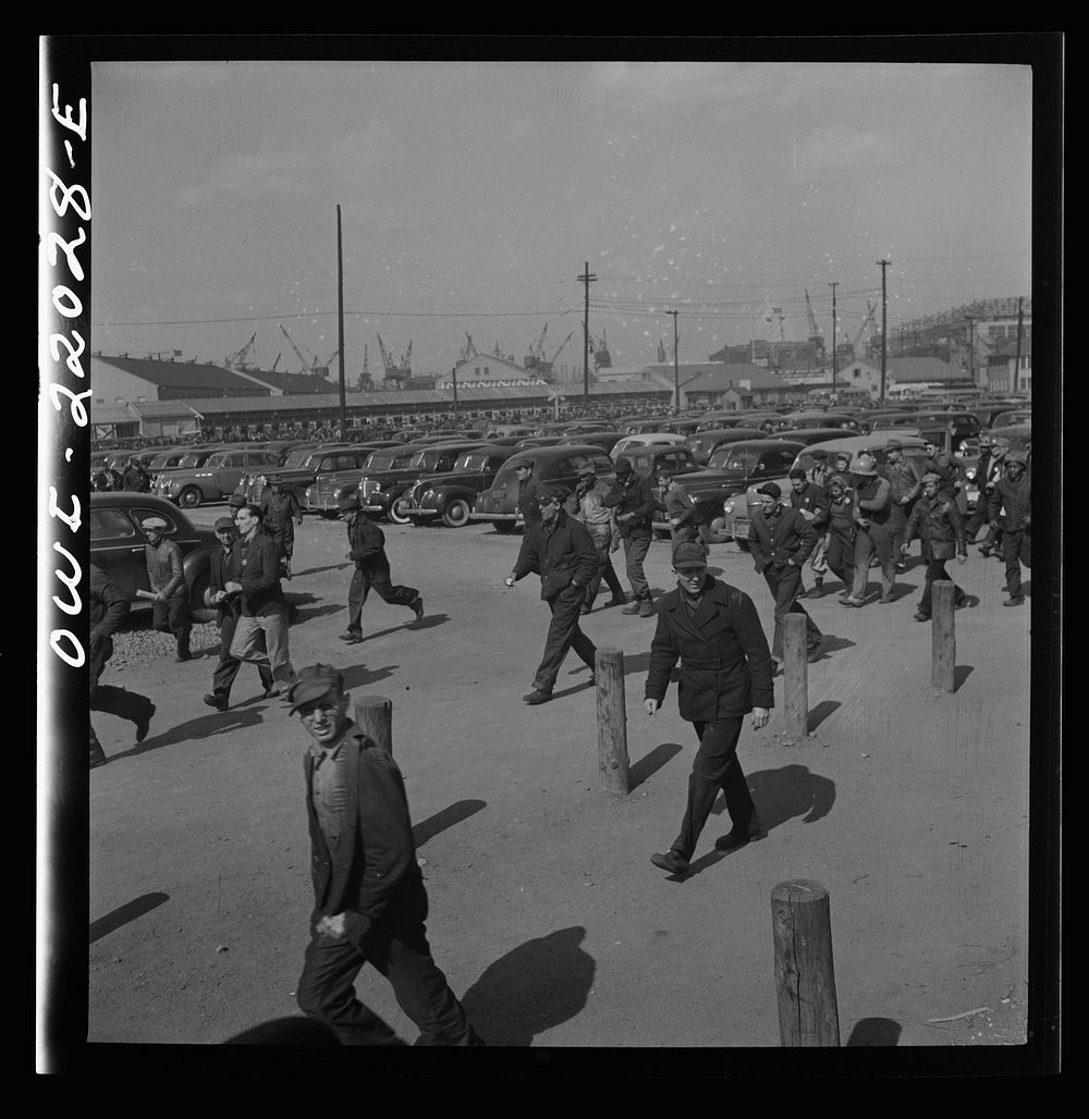 Baltimore, Maryland. Workers on the second shift who leave the Bethlehem Fairfield shipyard at three p.m. to get trolleys…