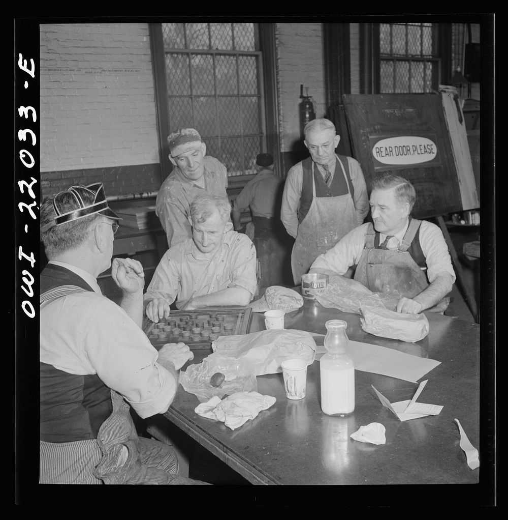 Baltimore, Maryland. Employees of the paint shop playing checkers during lunch at the Washington terminal of the Baltimore…