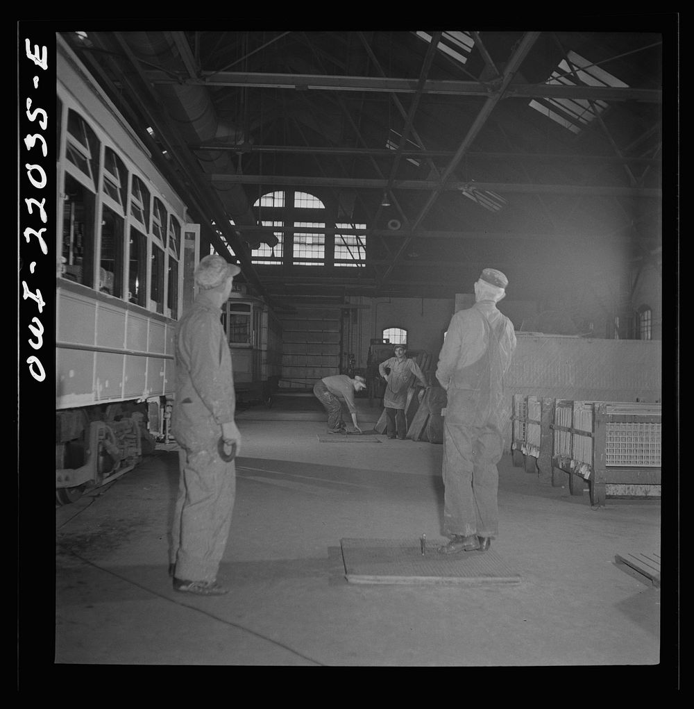 [Untitled photo, possibly related to: Baltimore, Maryland. Pitching horse shoes during lunch hour at the paint shop of the…