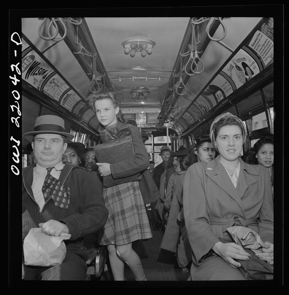 Baltimore, Maryland. School children and workers returning home on a trolley at five p.m.. Sourced from the Library of…