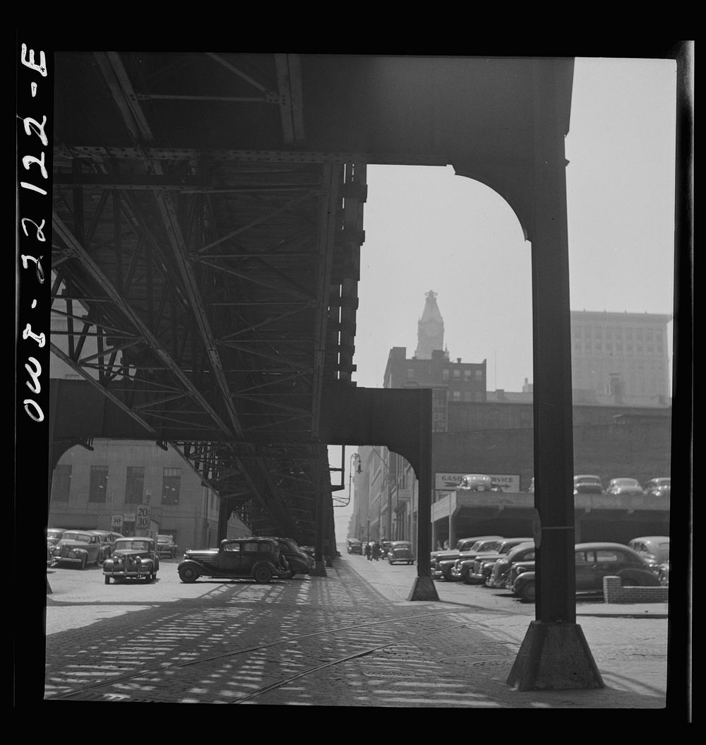 Baltimore, Maryland. Under the elevated trolley. The Baltimore Trust building is in the distance. Sourced from the Library…