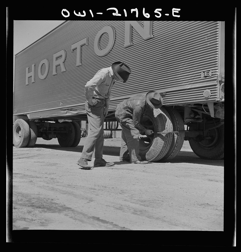 Burlington, North Carolina. Testing the thickness of tires on a trailer at the Associated Transport Company terminal.…