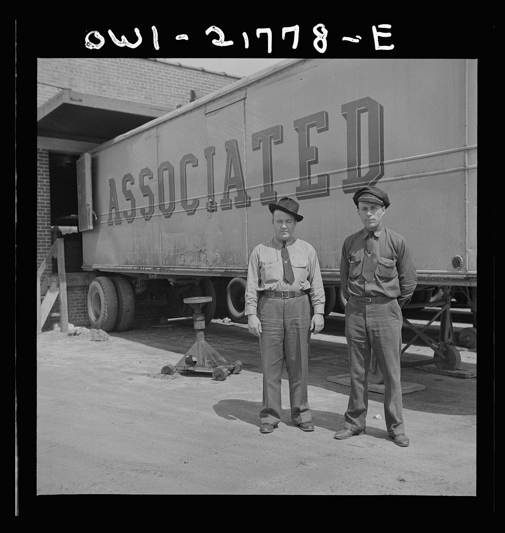 Atlanta, Georgia. Jim Bishop and Joe Crow, truck drivers for the Associated Transport Company terminal, before going out on…