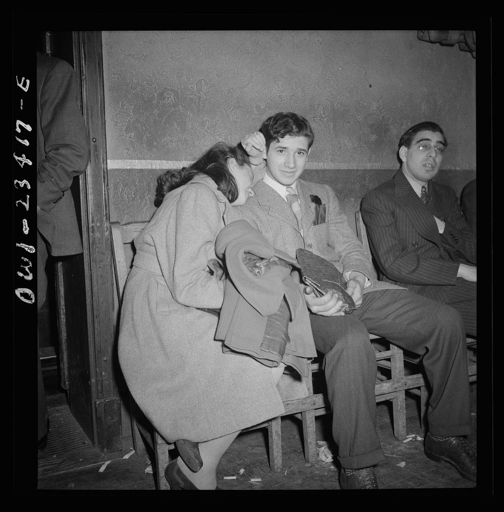 Buffalo, New York. Tired swingshift workers sitting on the sidelines at the swingshift dance held weekly from midnight to 4…