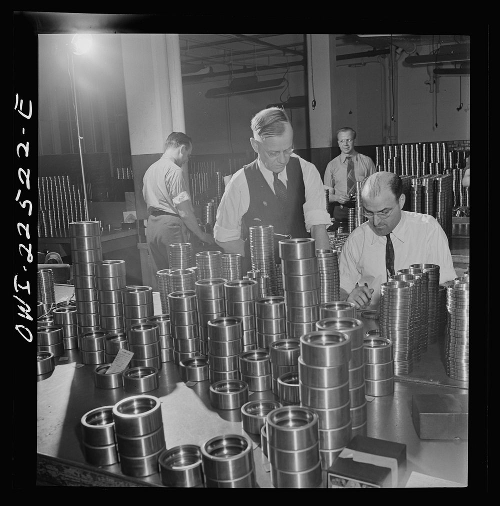 [Untitled photo, possibly related to: Philadelphia, Pennsylvania. Swedish-American foreman (left) at the SKF roller bearing…
