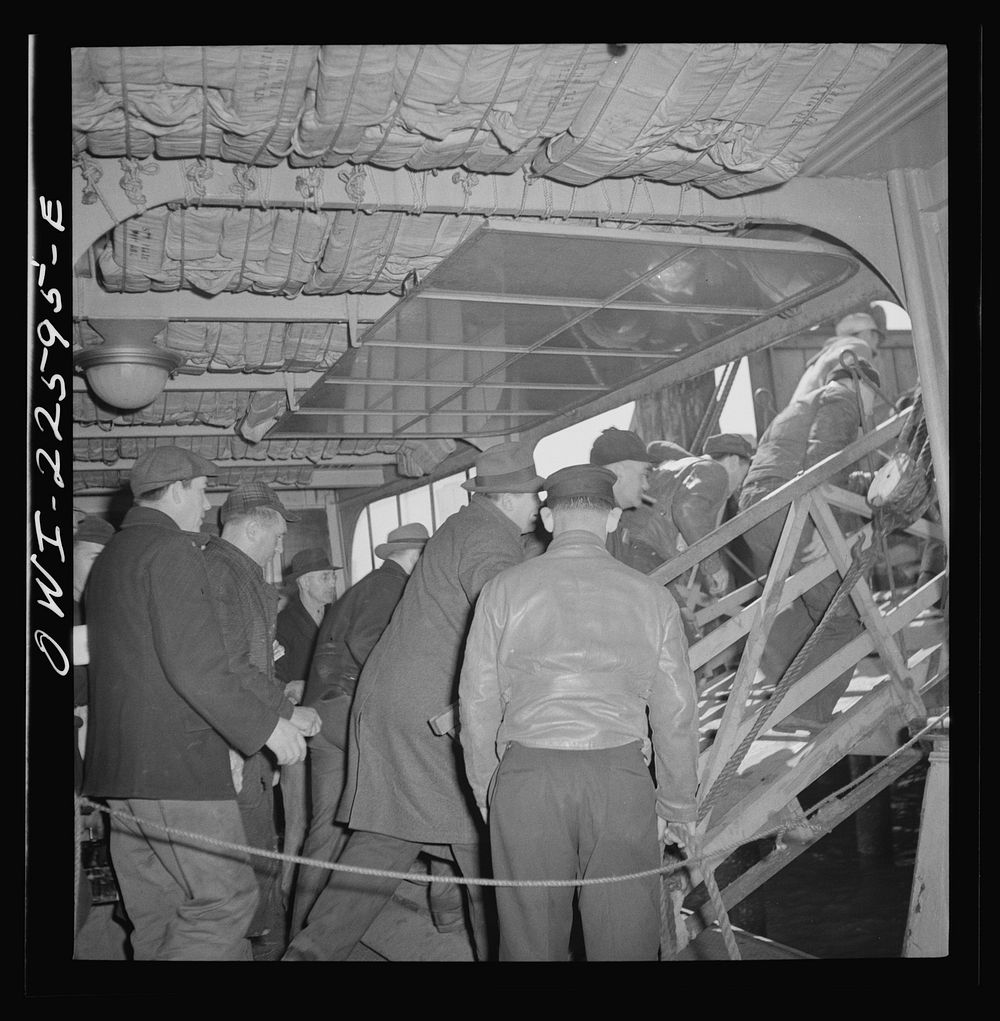 Baltimore, Maryland. Boarding a former Wilson Line boat, now used for transportation. Eighteen hundred men crowd onto the…