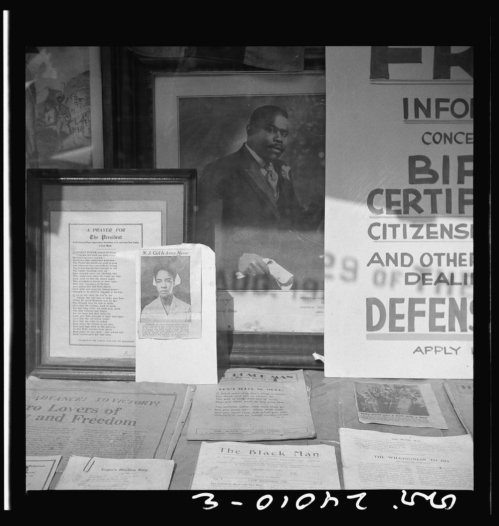 Signs in the windows of a Marcus Garvey club in the Harlem area. Sourced from the Library of Congress.