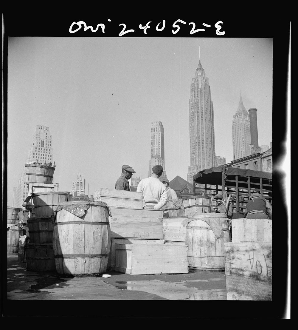 New York, New York. Fish caught off the New England coast is packed in these barrels and boxes and shipped to the retailers.…