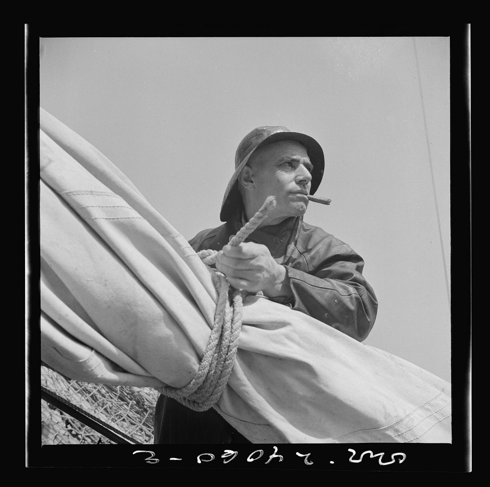 New York, New York. A New England fisherman preparing his boat to leave the New York docks. Sourced from the Library of…