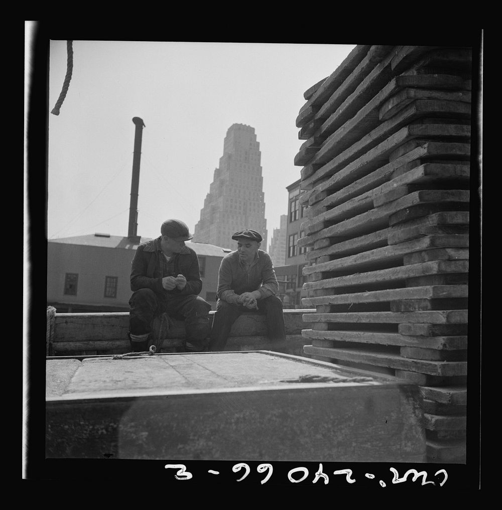 New York, New York. Gloucester fishermen resting on their boat at the Fulton fish market. Sourced from the Library of…