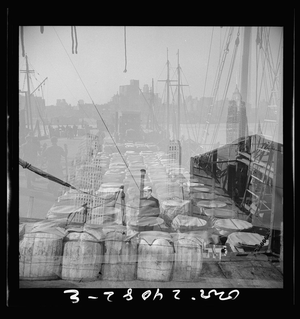 [Untitled photo, possibly related to: New York, New York. Barrels of fish on the docks at the Fulton fish market ready to be…