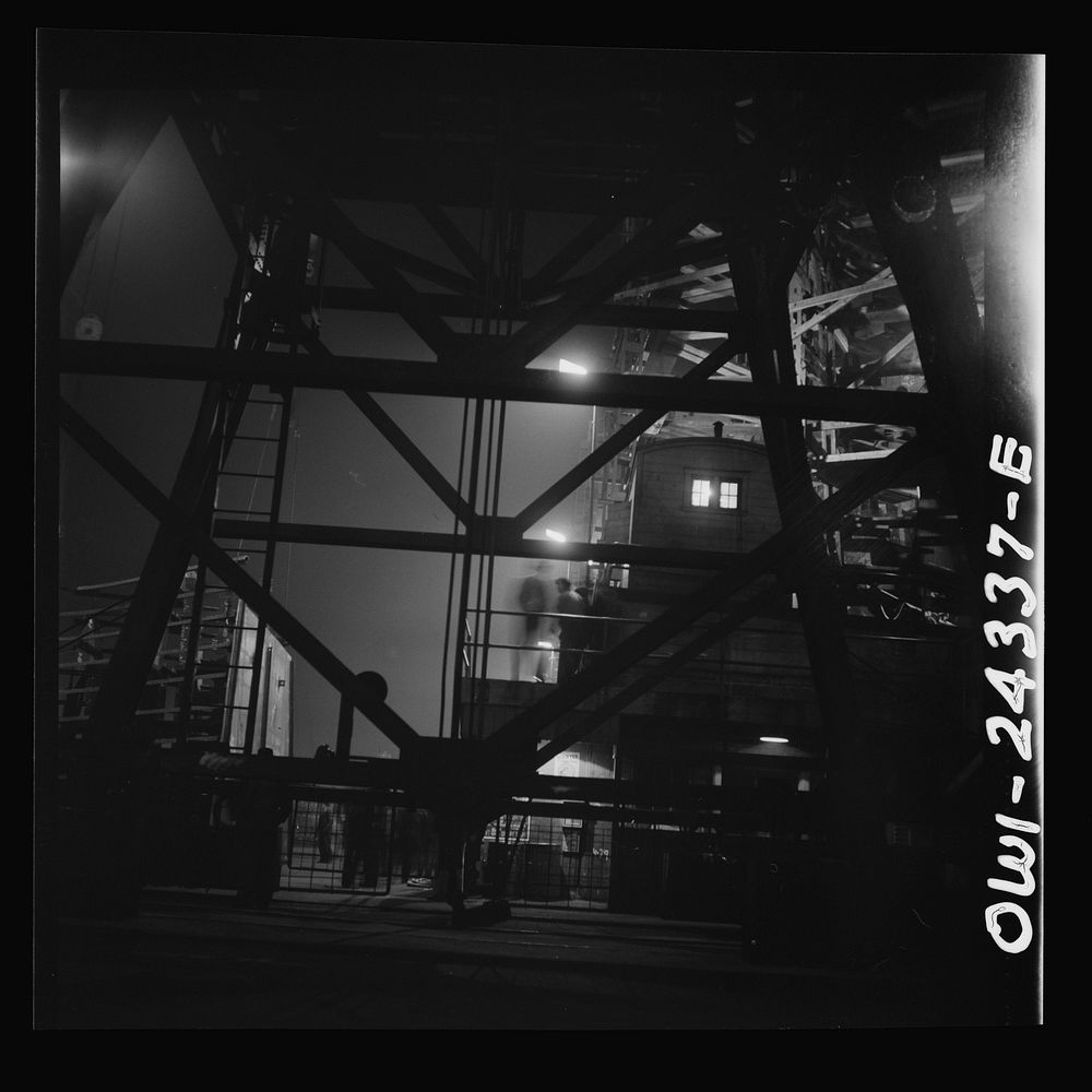Bethlehem-Fairfield shipyards, Baltimore, Maryland. A view looking through a crane structure. Sourced from the Library of…