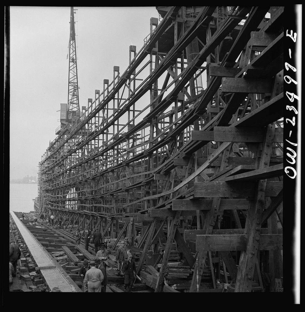 Bethlehem-Fairfield shipyards, Baltimore, Maryland. The stem of a vessel just after the launching ceremony. Sourced from the…