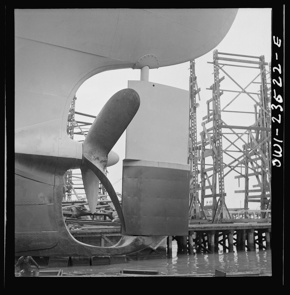 Bethlehem-Fairfield shipyards, Baltimore, Maryland. Propeller and rudder just before a launching. Sourced from the Library…