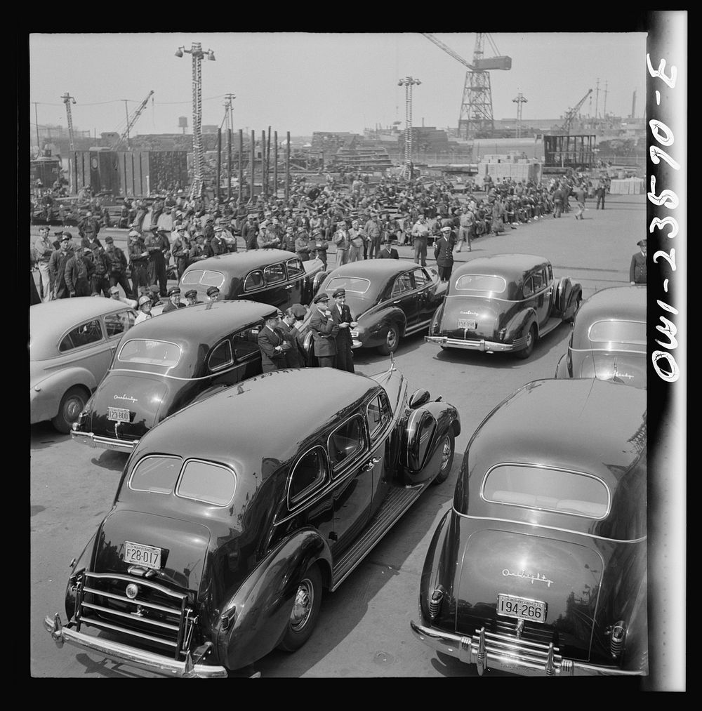 Bethlehem-Fairfield shipyards, Baltimore, Maryland. Automobiles used to transport a launching party. Sourced from the…