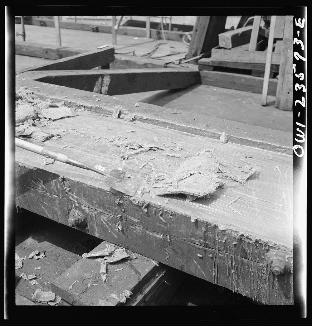 Bethlehem-Fairfield shipyards, Baltimore, Maryland. Removing grease from the ways after a ship launching ceremony. Sourced…
