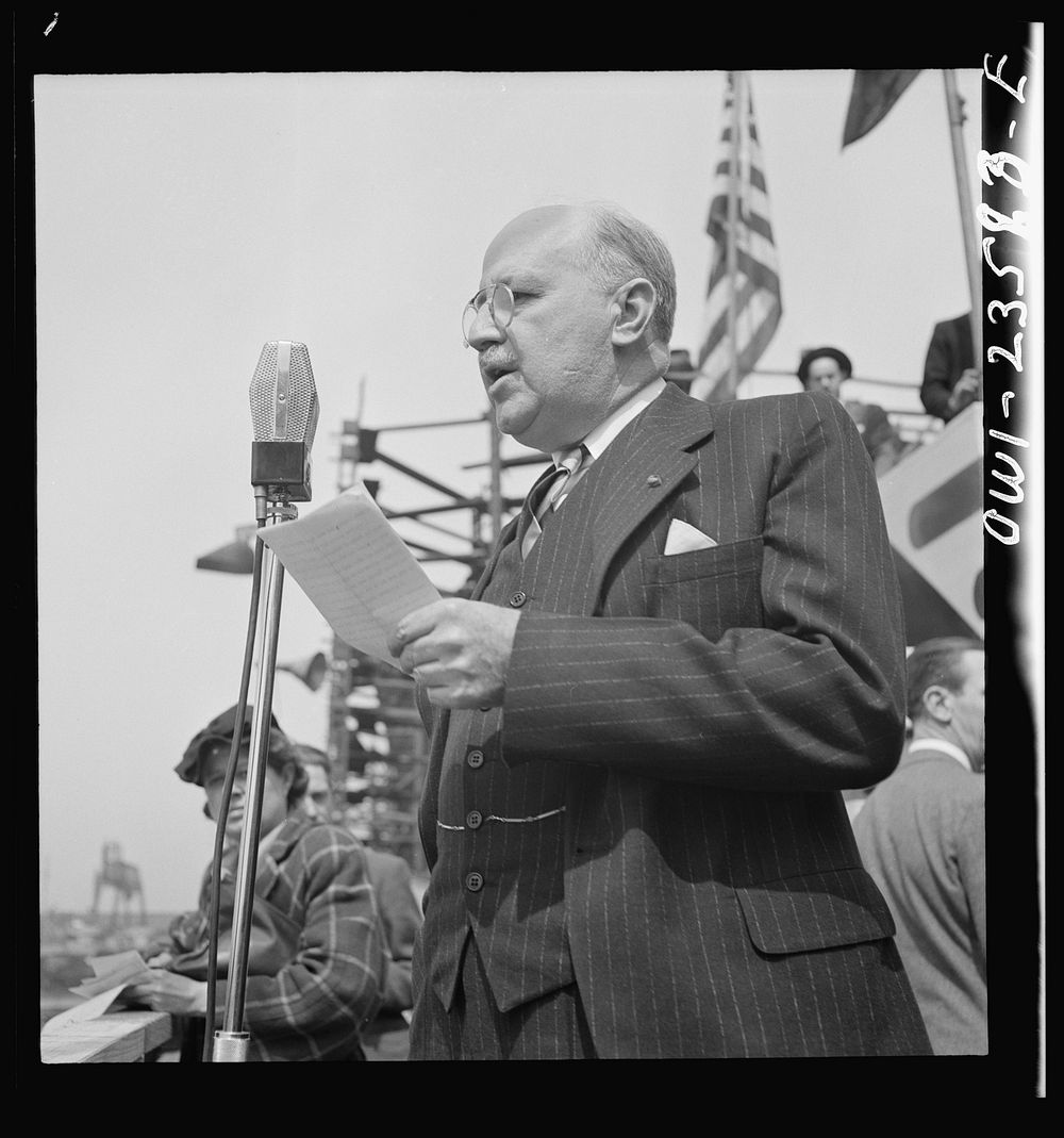 Bethlehem-Fairfield shipyards, Baltimore, Maryland. Guest speaker, a representative of the Maritime Commission, at a…