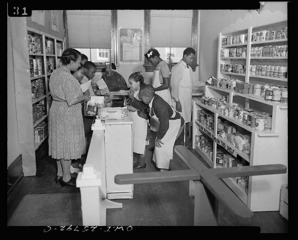 D-S store at the Douglas-Simmons Elementary School, Washington, D.C. The children are using the store to learn how to shop…