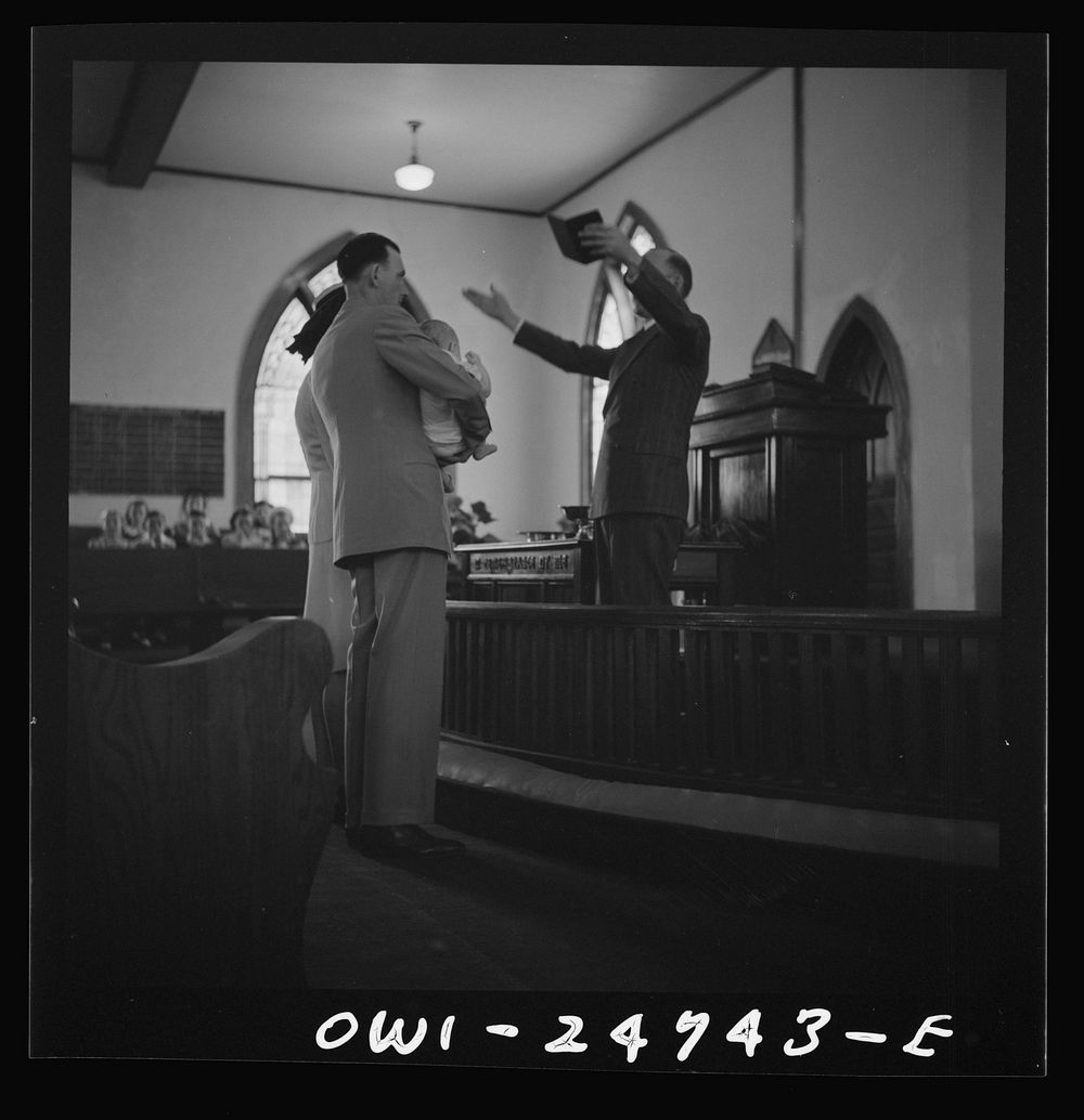 San Augustine, Texas. Reverend Dubberly, the Methodist minister, conducting a baptismal service on Easter Sunday. Sourced…
