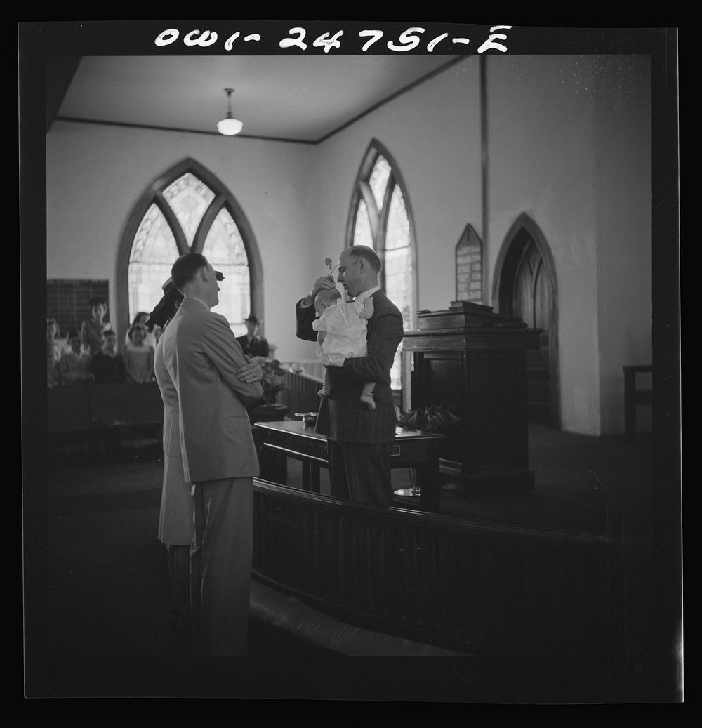 San Augustine, Texas. Reverend Dubberly baptizing a child. Sourced from the Library of Congress.