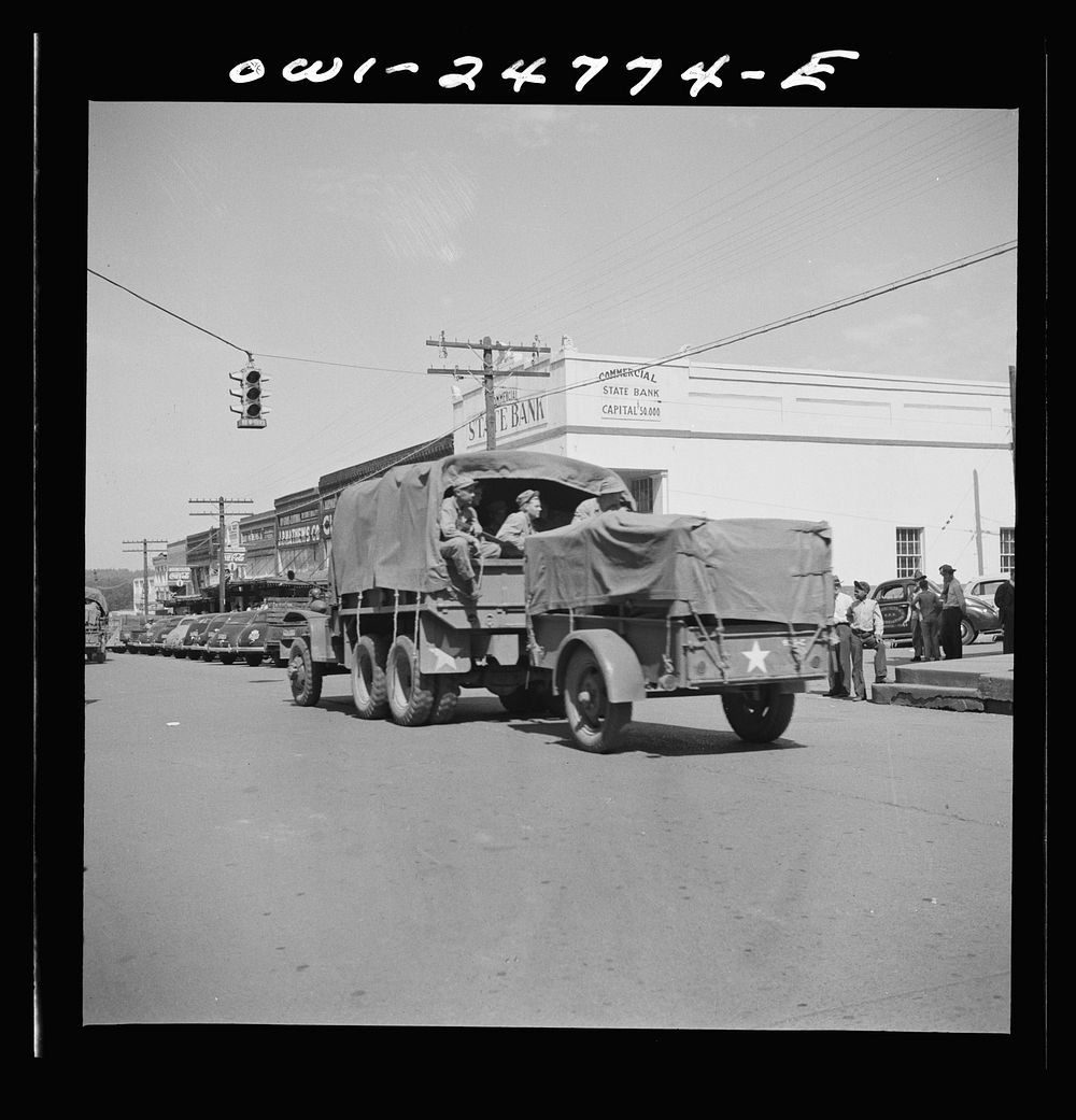 [Untitled photo, possibly related to: San Augustine, Texas. Troop movement through the main street]. Sourced from the…