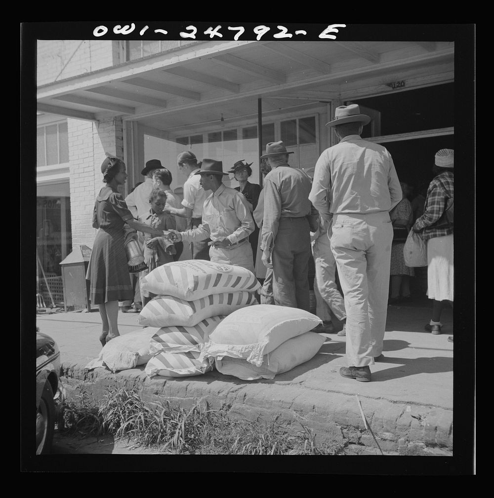 San Augustine, Texas. People in front of the feed stores. Sourced from the Library of Congress.