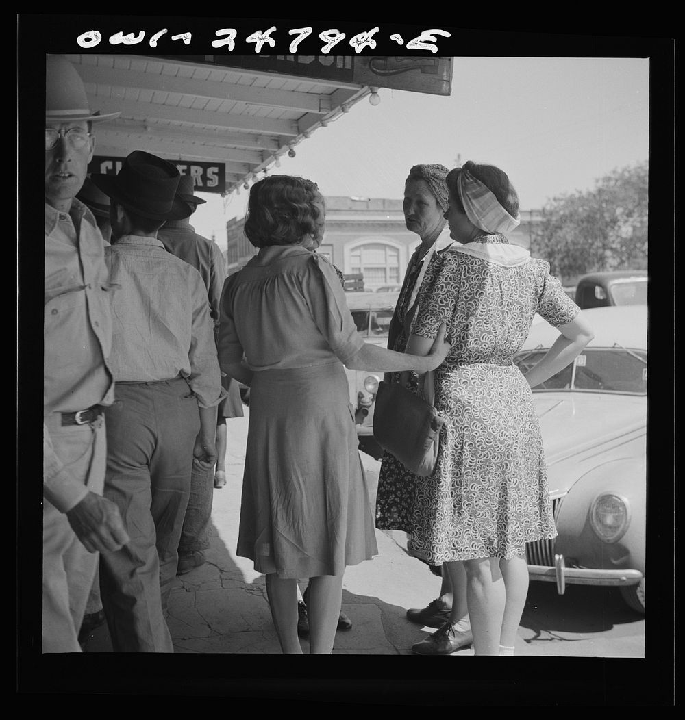 [Untitled photo, possibly related to: San Augustine, Texas. People on the main street on Saturday afternoon]. Sourced from…