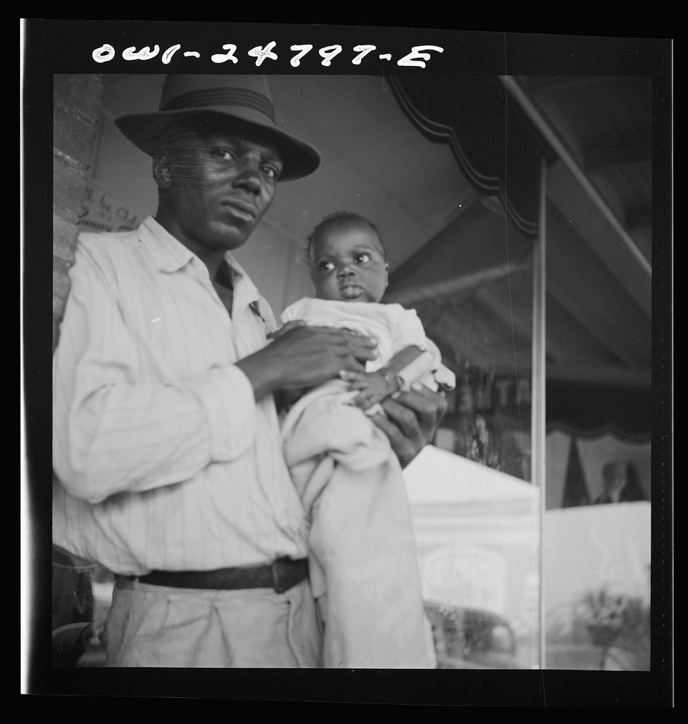 San Augustine, Texas. Father and daughter in front of the drugstore. Sourced from the Library of Congress.