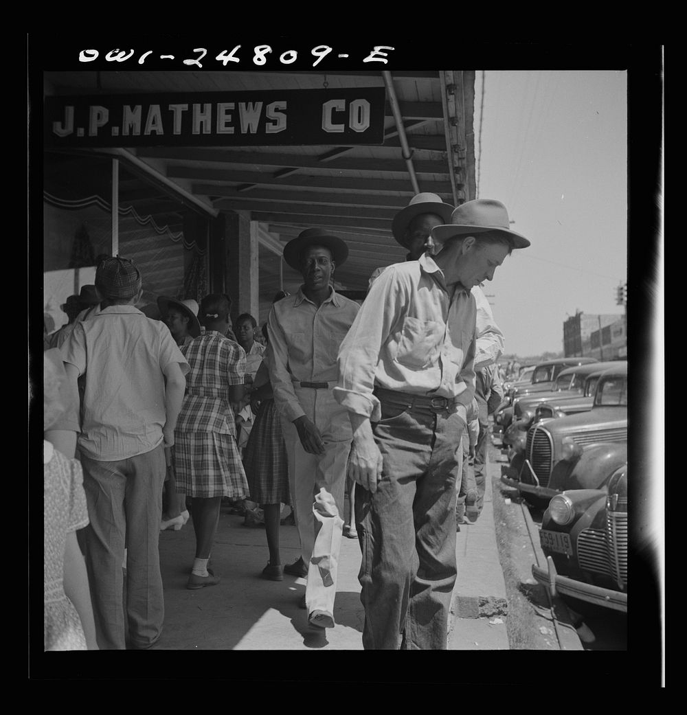 [Untitled photo, possibly related to: San Augustine, Texas. People on the main street on Saturday afternoon]. Sourced from…
