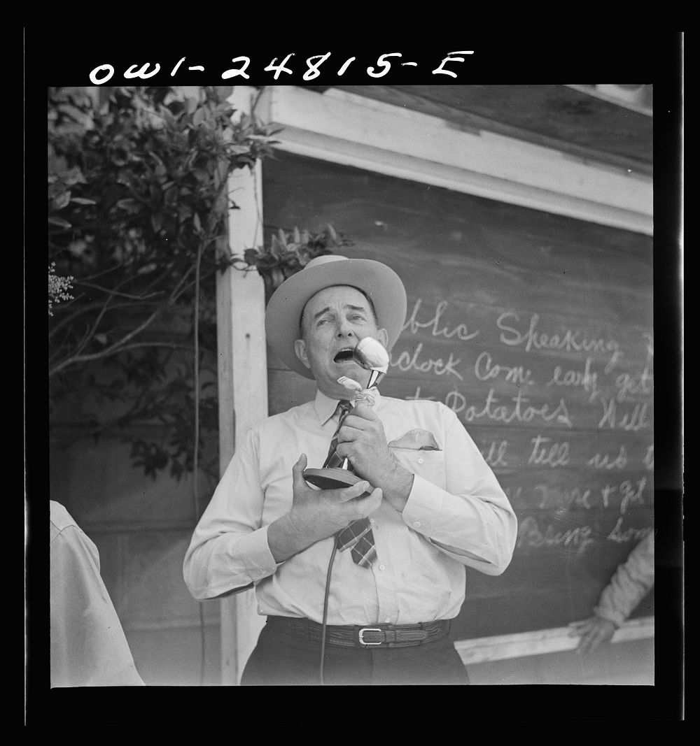 San Augustine, Texas. W.C. Gary, county surveyor and commander of the local home guard, making a speech over the public…