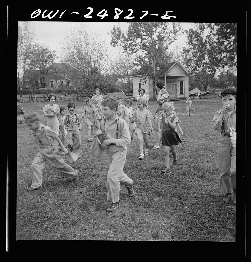 San Augustine, Texas. Children having an Easter egg hunt on the school grounds on the last day of school before Easter…