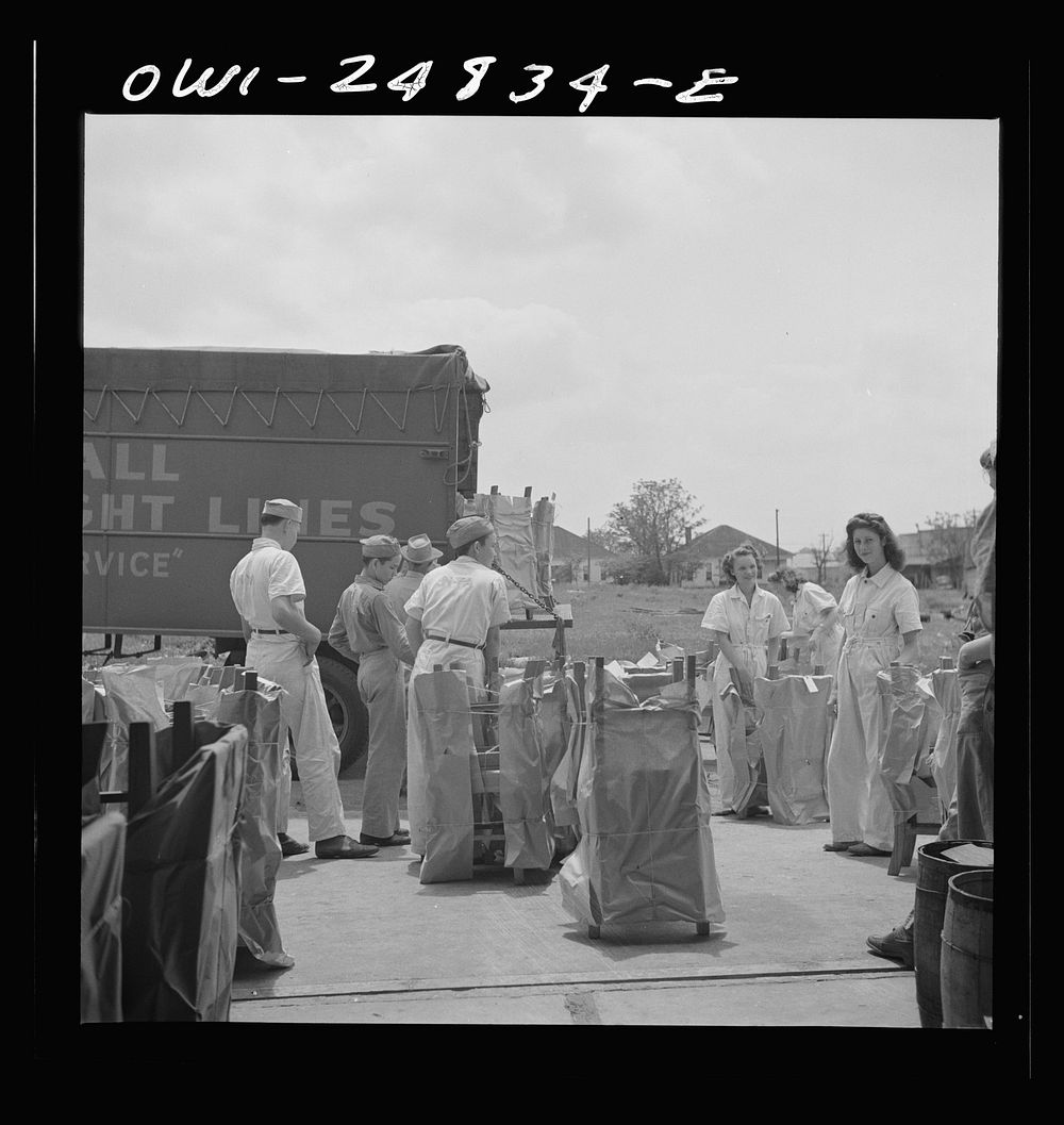 [Untitled photo, possibly related to: San Augustine, Texas. Girls loading chairs which they made in NYA (National Youth…