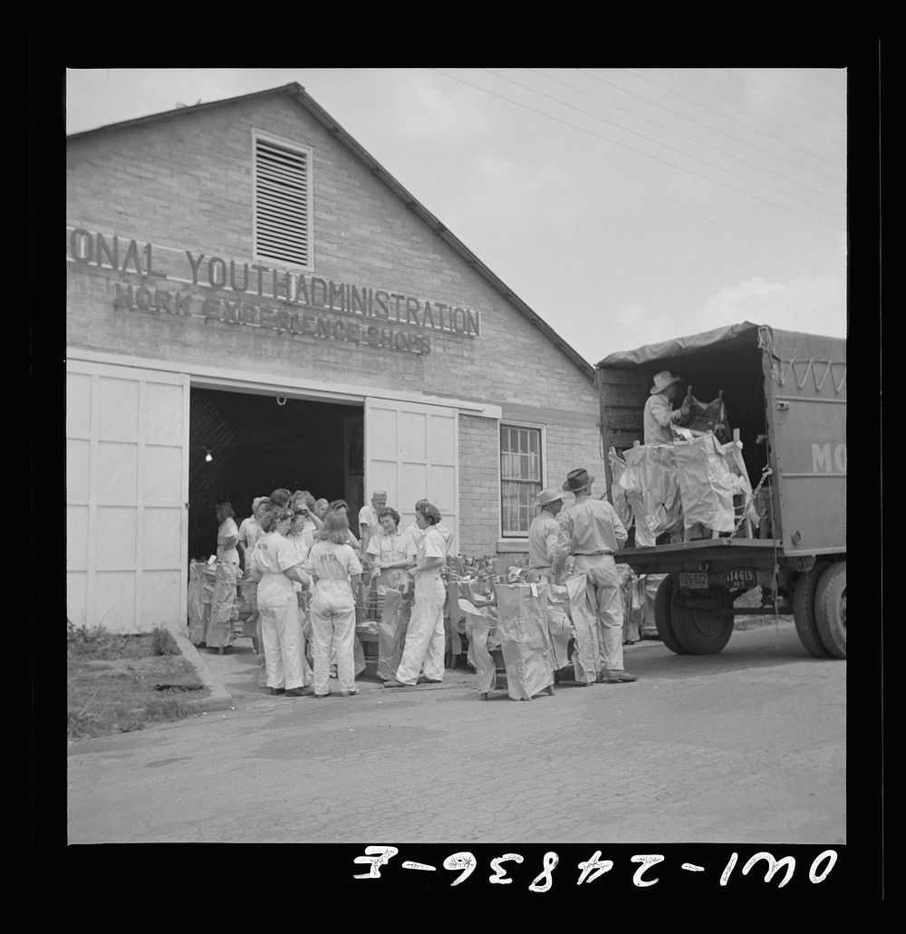 [Untitled photo, possibly related to: San Augustine, Texas. Girls loading chairs which they made in NYA (National Youth…