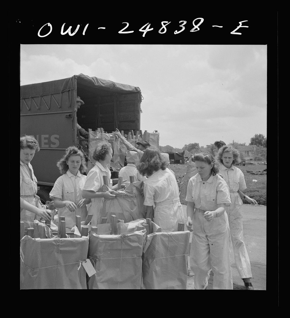 San Augustine, Texas. Girls loading chairs which they made in NYA (National Youth Administration) woodworking shop onto a…