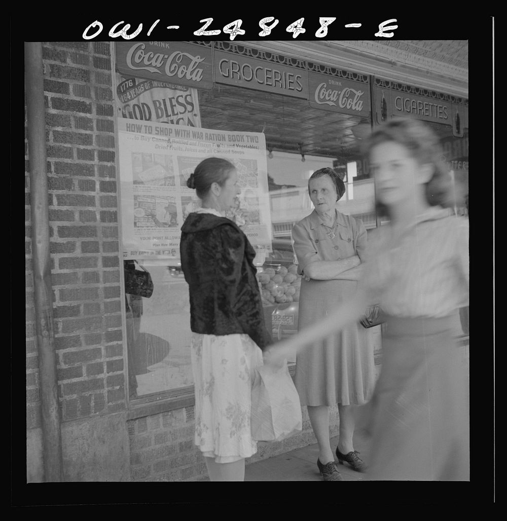 [Untitled photo, possibly related to: San Augustine, Texas. Women talking in front of the grocery store on a Saturday…