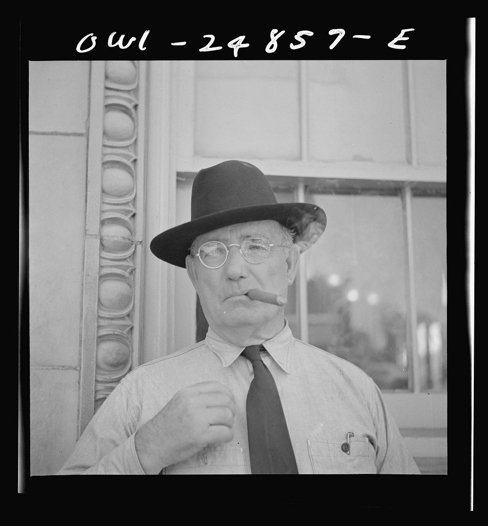 San Augustine, Texas. Man in front of the bank. Sourced from the Library of Congress.