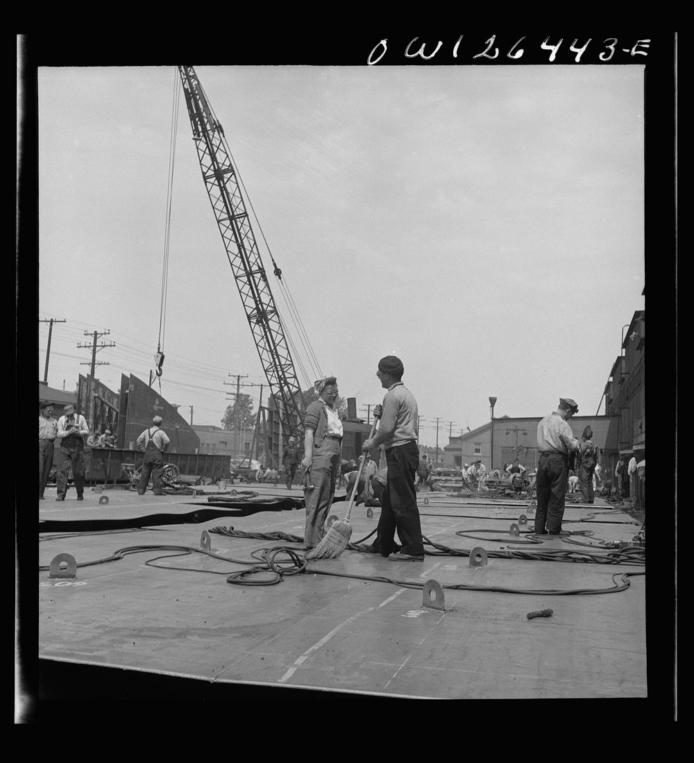 [Untitled photo, possibly related to: Bethlehem-Fairfield shipyards, Baltimore, Maryland. Transferring a steel section from…
