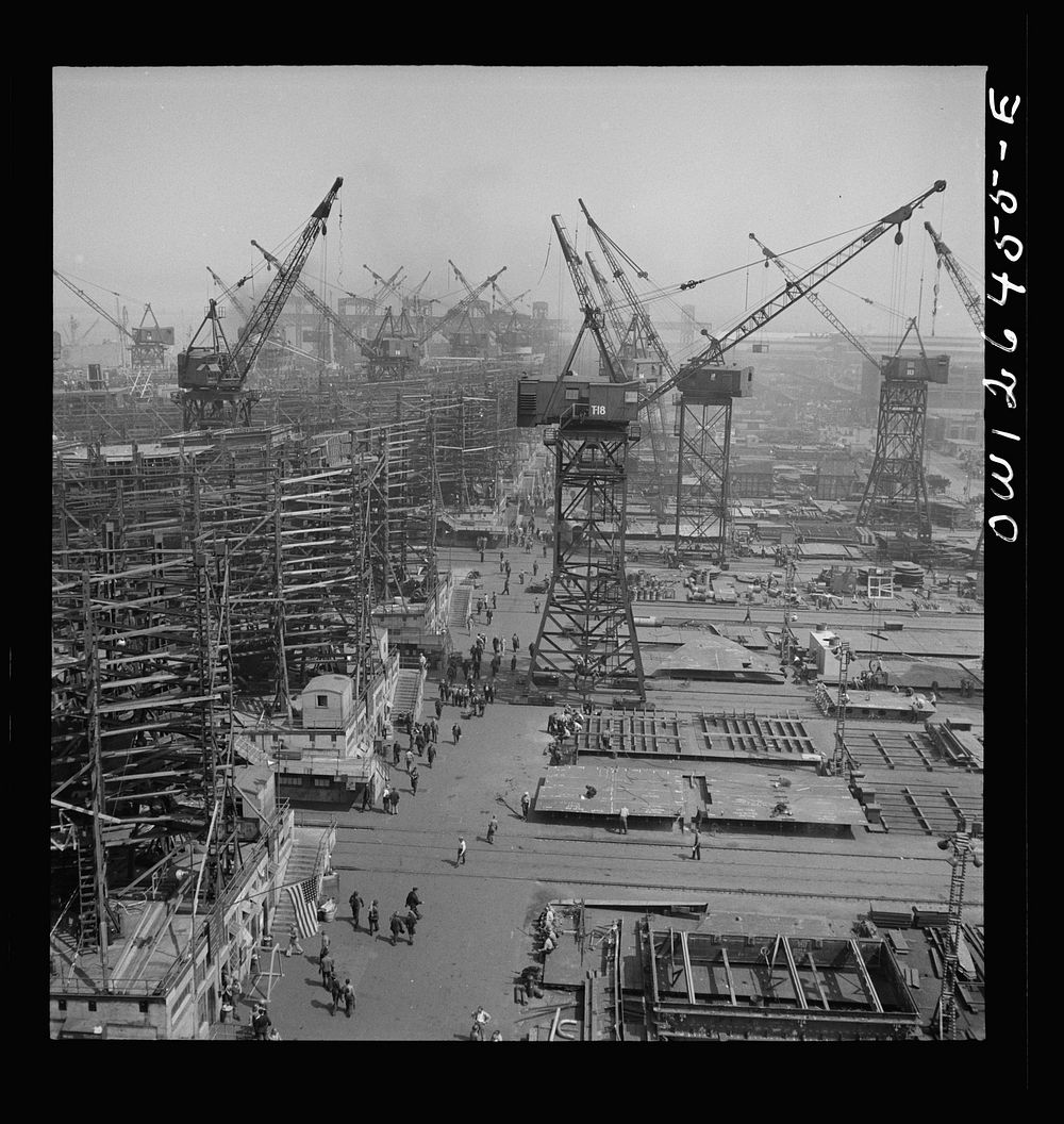 Bethlehem-Fairfield shipyards, Baltimore, Maryland. A shipyard with a crane. Sourced from the Library of Congress.