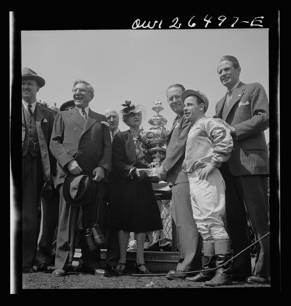 Pimlico racetrack, near Baltimore, Maryland. Owner and jockey of Count Fleet receiving Preakness Cup. Sourced from the…